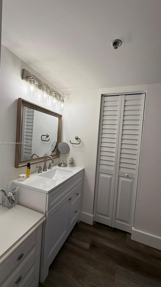 3910 Inverrary Blvd Unit 503-B, Lauderhill, FL 33319 - bathroom featuring vanity, wood finished floors, and a closet