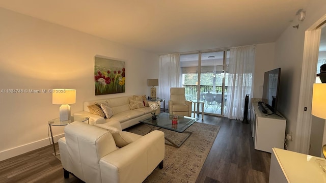 3910 Inverrary Blvd Unit 503-B, Lauderhill, FL 33319 - living area with dark wood-style flooring and baseboards