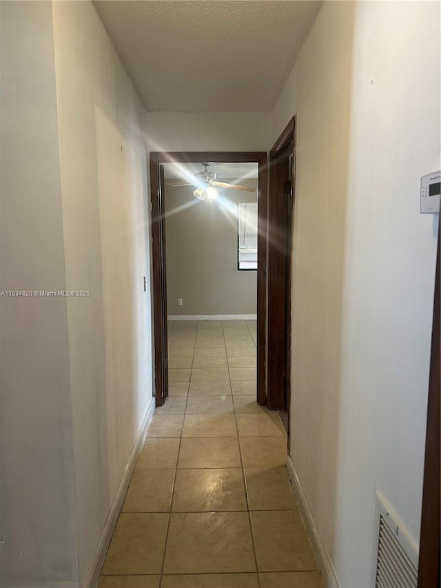 532 Bond, Clewiston, FL 33440 - hall featuring light tile patterned floors and baseboards