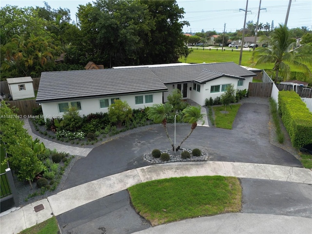 9471 SW 10th St, Miami, FL 33174 - ranch-style home featuring curved driveway, stucco siding, and a tiled roof