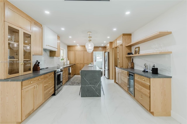 9471 SW 10th St, Miami, FL 33174 - kitchen featuring appliances with stainless steel finishes, beverage cooler, light brown cabinetry, dark countertops, and a center island