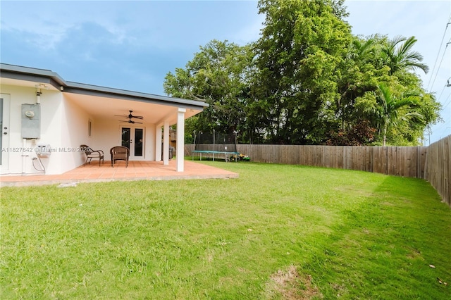 9471 SW 10th St, Miami, FL 33174 - fenced backyard featuring a trampoline, french doors, a ceiling fan, and a patio