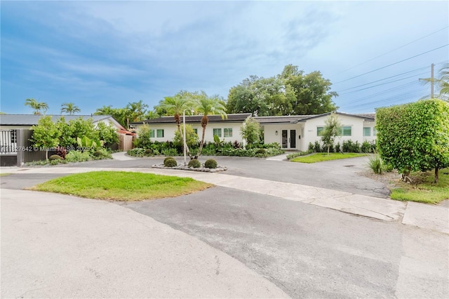 9471 SW 10th St, Miami, FL 33174 - single story home featuring curved driveway, french doors, and stucco siding