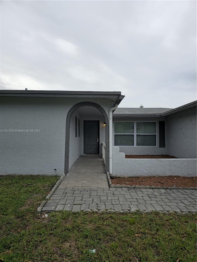 7771 NW 46th St, Lauderhill, FL 33351 - view of exterior entry featuring stucco siding
