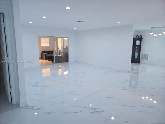 7771 NW 46th St, Lauderhill, FL 33351 - spare room featuring light marble finish flooring and recessed lighting