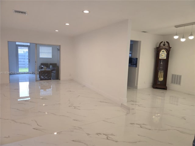 7771 NW 46th St, Lauderhill, FL 33351 - unfurnished room with recessed lighting and light marble finish floors