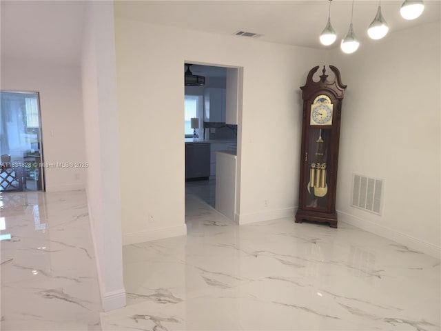 7771 NW 46th St, Lauderhill, FL 33351 - hallway featuring marble tiled flooring and baseboards