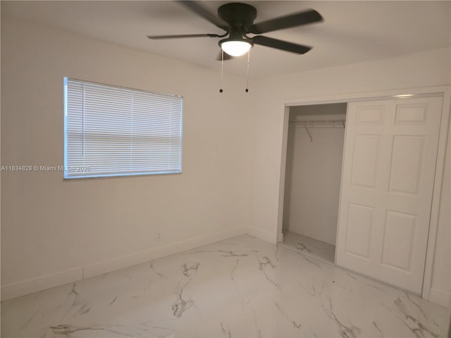 7771 NW 46th St, Lauderhill, FL 33351 - unfurnished bedroom with marble finish floors, a closet, and a ceiling fan