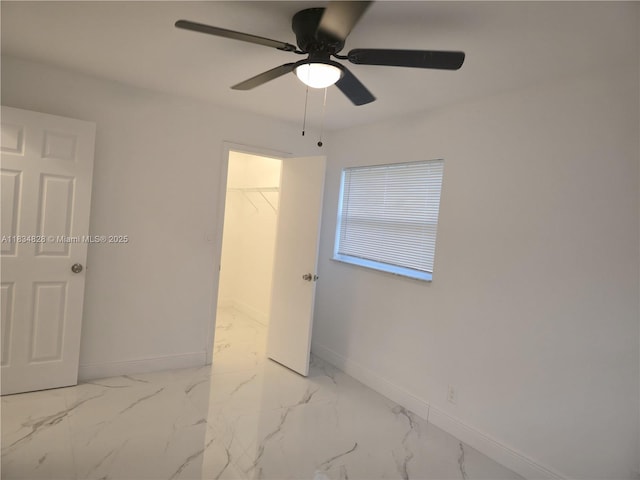 7771 NW 46th St, Lauderhill, FL 33351 - unfurnished bedroom with a walk in closet, marble finish flooring, and ceiling fan