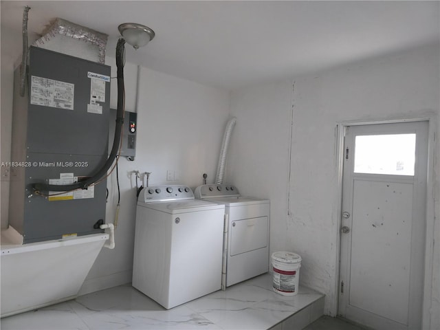 7771 NW 46th St, Lauderhill, FL 33351 - laundry room featuring washing machine and dryer and light marble finish floors