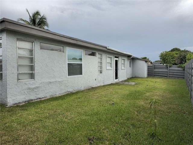7771 NW 46th St, Lauderhill, FL 33351 - rear view of house with stucco siding