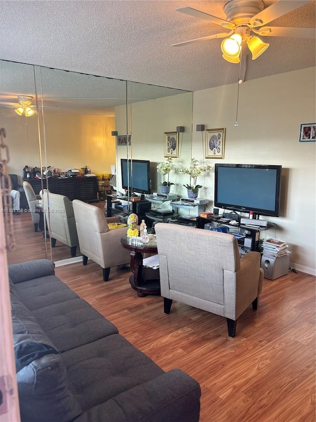 1301 SW 134th Way Unit 307B, Pembroke Pines, FL 33027 - living room featuring a ceiling fan, wood finished floors, and a textured ceiling
