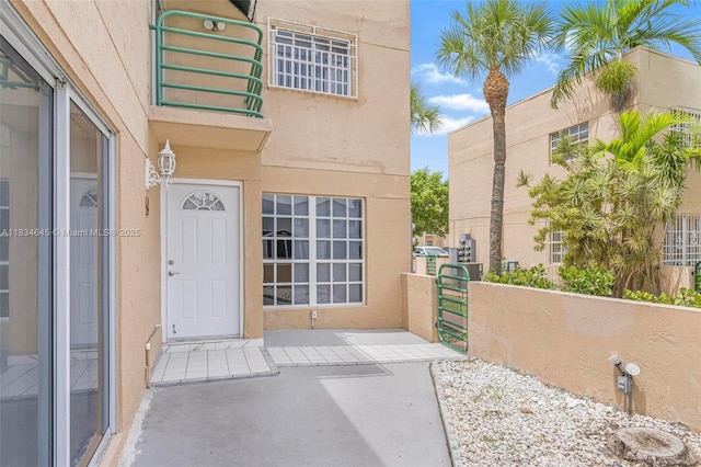 11955 SW 18th Ter Unit 9, Miami, FL 33175 - entrance to property featuring stucco siding and a gate