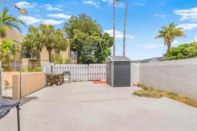 11955 SW 18th Ter Unit 9, Miami, FL 33175 - fenced backyard with a patio and a shed
