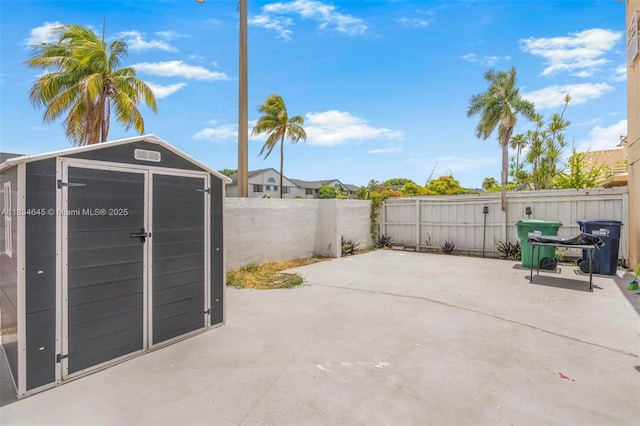 11955 SW 18th Ter Unit 9, Miami, FL 33175 - fenced backyard featuring a patio and a storage shed