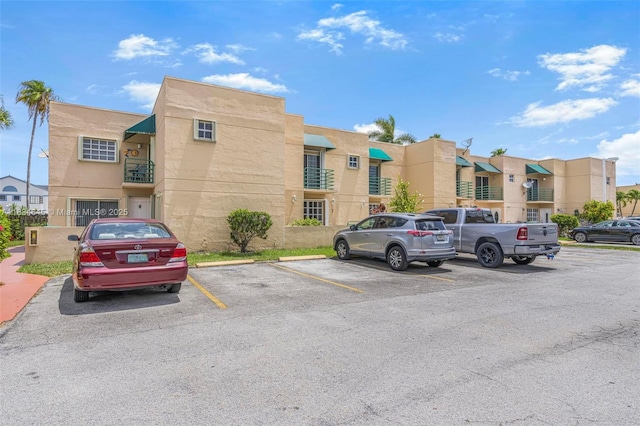 11955 SW 18th Ter Unit 9, Miami, FL 33175 - view of building exterior with uncovered parking and a residential view