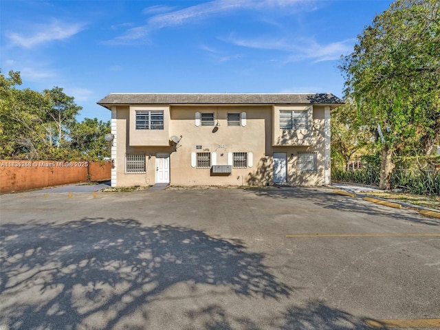 842 NW 1st Ave, Fort Lauderdale, FL 33311 - view of front of property with stucco siding and uncovered parking