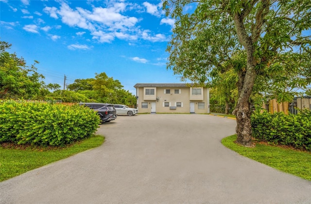 842 NW 1st Ave, Fort Lauderdale, FL 33311 - view of front of home featuring uncovered parking and stucco siding