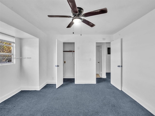 842 NW 1st Ave, Fort Lauderdale, FL 33311 - unfurnished bedroom featuring dark colored carpet, ceiling fan, and a closet