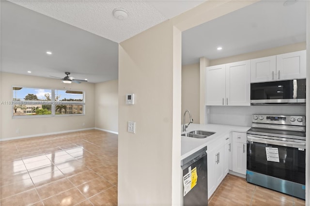 3405 NW 48th Ave Unit 610, Lauderdale Lakes, FL 33319 - kitchen featuring stainless steel appliances, white cabinets, light countertops, light tile patterned floors, and recessed lighting