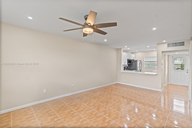 3405 NW 48th Ave Unit 610, Lauderdale Lakes, FL 33319 - unfurnished living room featuring a ceiling fan, light tile patterned floors, and recessed lighting
