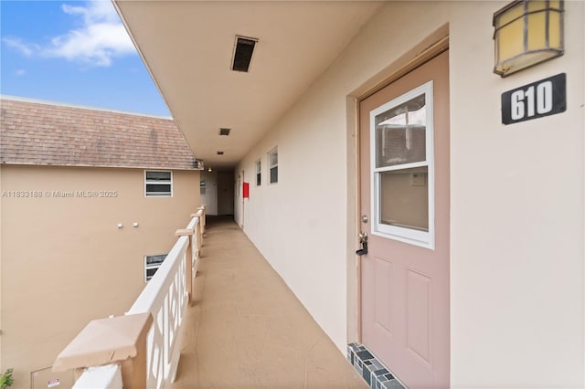 3405 NW 48th Ave Unit 610, Lauderdale Lakes, FL 33319 - entrance to property featuring stucco siding, a balcony, and a shingled roof