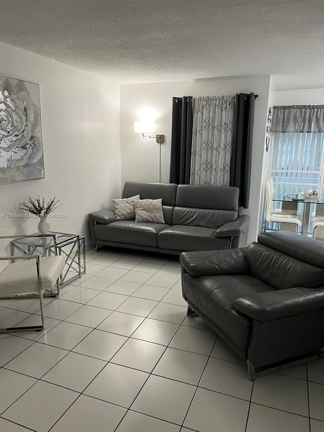 9370 W Flagler St Unit 104B, Miami, FL 33174 - living room featuring a textured ceiling and light tile patterned floors
