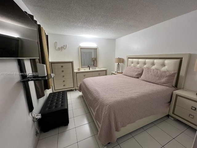 9370 W Flagler St Unit 104B, Miami, FL 33174 - bedroom with light tile patterned floors and a textured ceiling