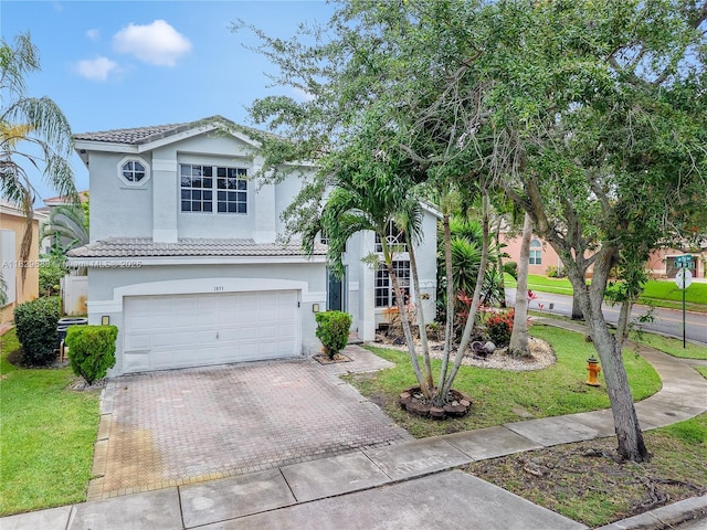 1891 SW 156th Ave, Miramar, FL 33027 - view of front of house featuring decorative driveway, stucco siding, an attached garage, a tile roof, and a front lawn