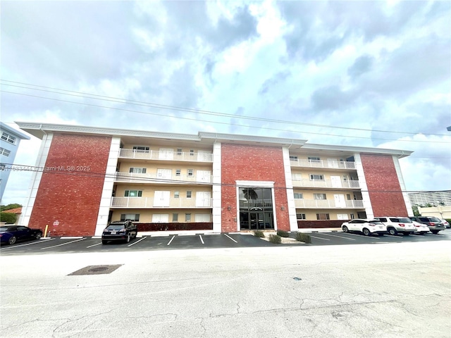 2841 NE 33rd Ct Unit 104, Fort Lauderdale, FL 33306 - view of apartment building / complex with uncovered parking