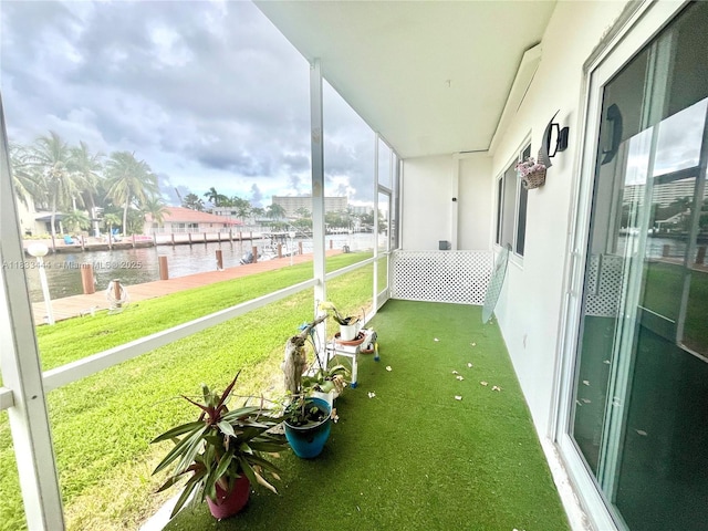 2841 NE 33rd Ct Unit 104, Fort Lauderdale, FL 33306 - unfurnished sunroom featuring a water view