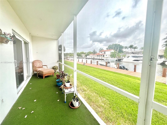 2841 NE 33rd Ct Unit 104, Fort Lauderdale, FL 33306 - unfurnished sunroom with a water view