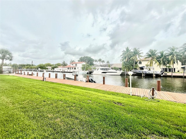 2841 NE 33rd Ct Unit 104, Fort Lauderdale, FL 33306 - dock with a lawn and a water view