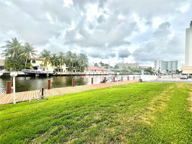 2841 NE 33rd Ct Unit 104, Fort Lauderdale, FL 33306 - dock area with a lawn and a water view
