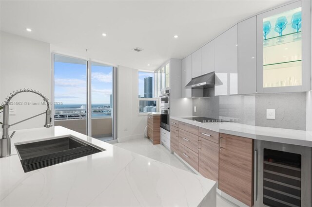 848 Brickell Key Dr Unit 2705, Miami, FL 33131 - living room with wine cooler, light tile patterned flooring, plenty of natural light, and recessed lighting