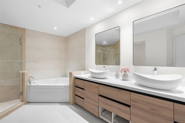 848 Brickell Key Dr Unit 2705, Miami, FL 33131 - full bathroom with a garden tub, a stall shower, double vanity, and recessed lighting