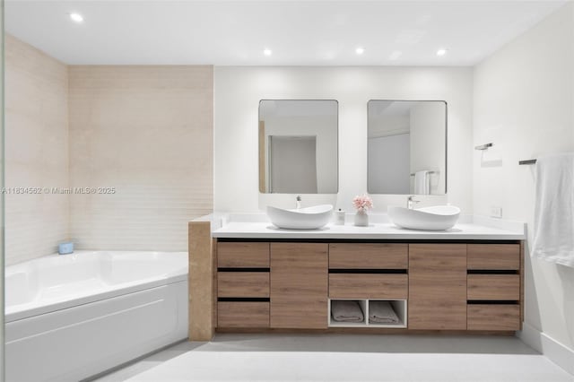848 Brickell Key Dr Unit 2705, Miami, FL 33131 - full bath featuring double vanity, a garden tub, and recessed lighting