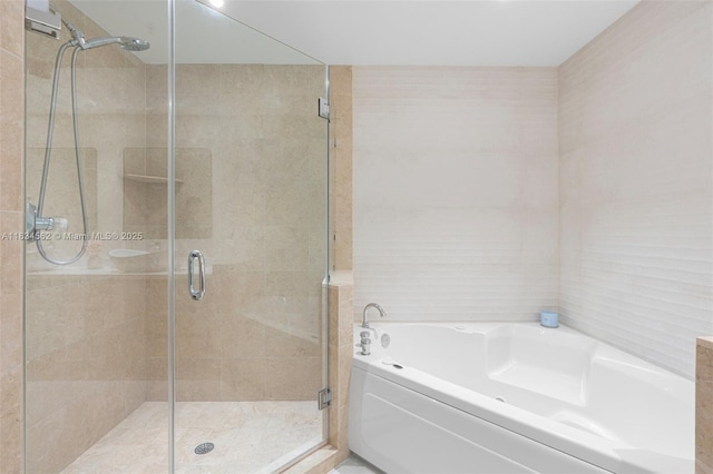 848 Brickell Key Dr Unit 2705, Miami, FL 33131 - full bathroom with a bath, a stall shower, and tile walls