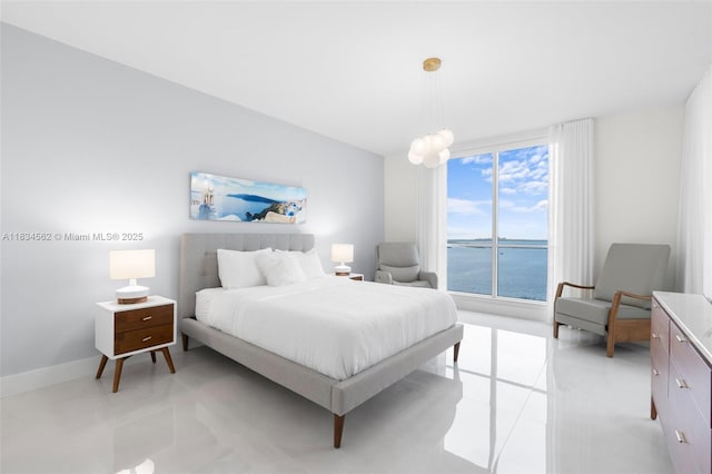 848 Brickell Key Dr Unit 2705, Miami, FL 33131 - bedroom with light tile patterned flooring and a water view