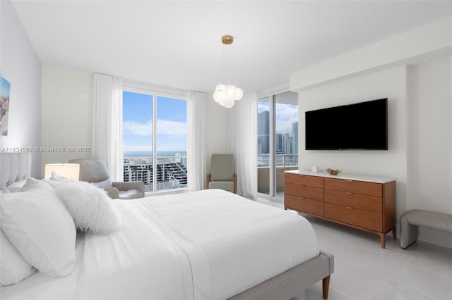 848 Brickell Key Dr Unit 2705, Miami, FL 33131 - bedroom with access to outside and a wall of windows