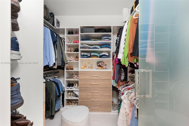 848 Brickell Key Dr Unit 2705, Miami, FL 33131 - spacious closet featuring tile patterned floors