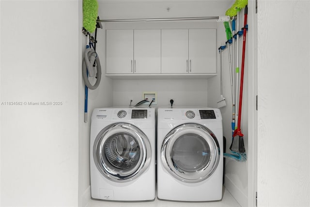848 Brickell Key Dr Unit 2705, Miami, FL 33131 - laundry area with washer and clothes dryer and cabinet space