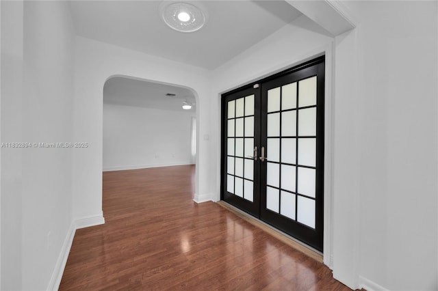 7804 SW 178th Ter, Palmetto Bay, FL 33157 - hall with french doors, arched walkways, and wood finished floors