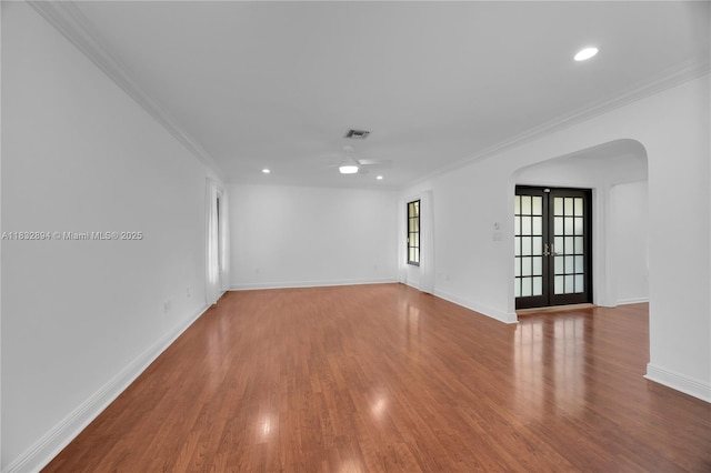 7804 SW 178th Ter, Palmetto Bay, FL 33157 - empty room featuring a ceiling fan, wood finished floors, crown molding, arched walkways, and recessed lighting