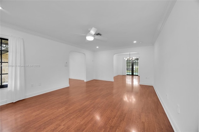 7804 SW 178th Ter, Palmetto Bay, FL 33157 - spare room with arched walkways, a chandelier, crown molding, wood finished floors, and recessed lighting