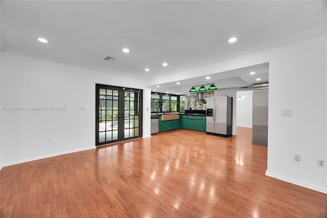 7804 SW 178th Ter, Palmetto Bay, FL 33157 - unfurnished living room with ornamental molding, recessed lighting, french doors, and light wood-type flooring