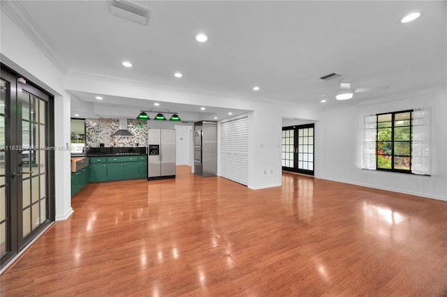 7804 SW 178th Ter, Palmetto Bay, FL 33157 - unfurnished living room featuring ornamental molding, french doors, recessed lighting, and light wood-style flooring