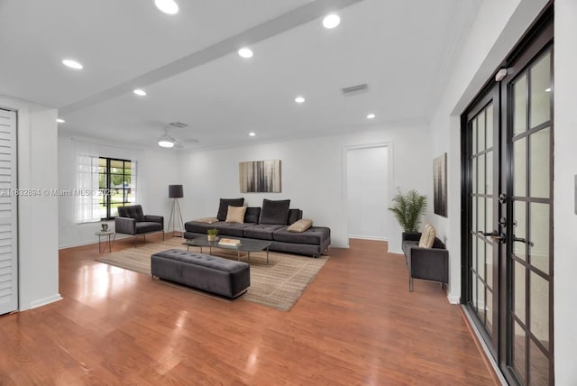 7804 SW 178th Ter, Palmetto Bay, FL 33157 - living room with wood finished floors, recessed lighting, crown molding, and french doors