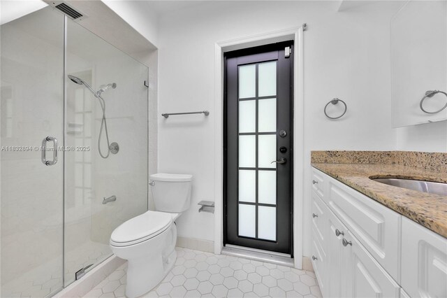 7804 SW 178th Ter, Palmetto Bay, FL 33157 - bathroom featuring healthy amount of natural light, vanity, a stall shower, and tile patterned floors