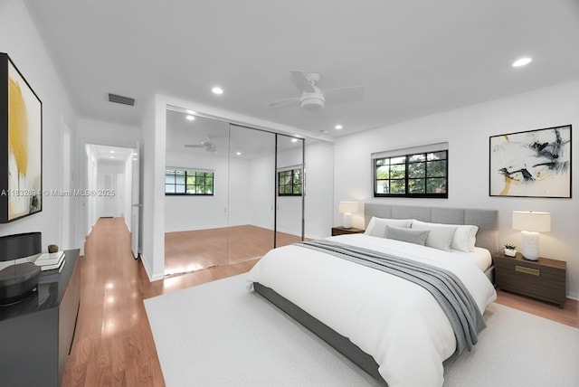 7804 SW 178th Ter, Palmetto Bay, FL 33157 - bedroom with a closet, light wood finished floors, recessed lighting, and a ceiling fan